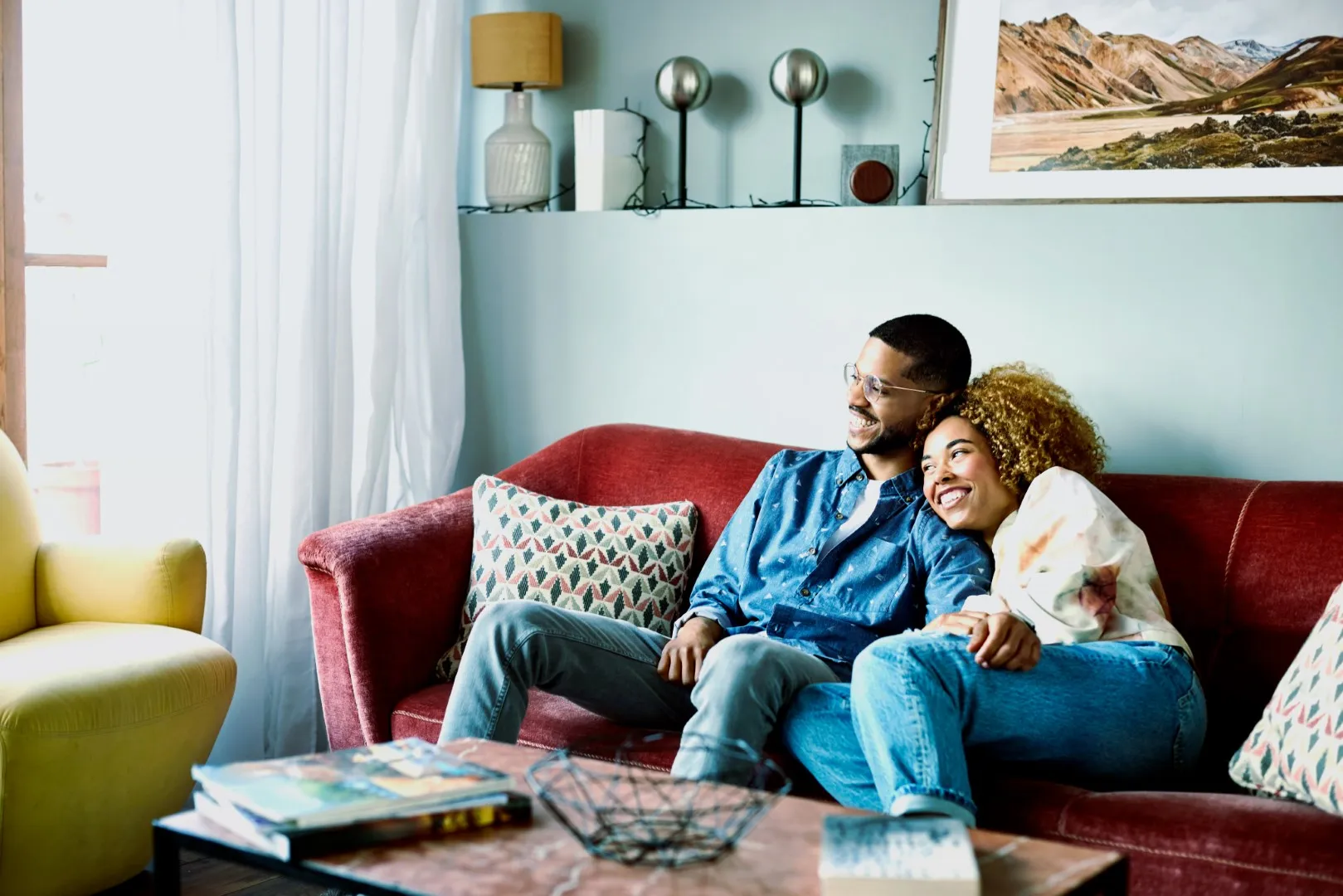 Family watching TV together at home